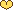 pixel art of a small yellow heart